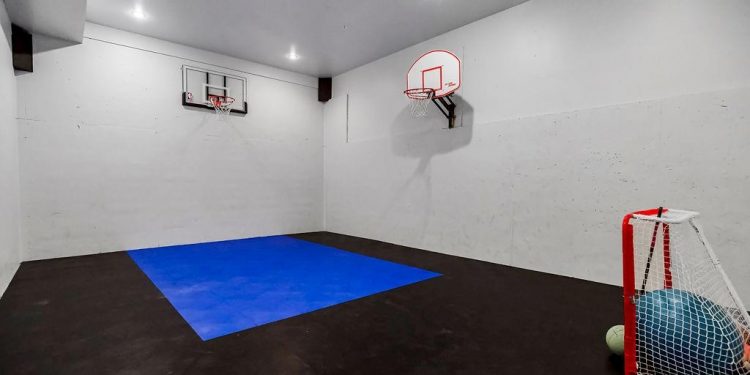 Discover Your Dream Mansion with a Private Sports Court in Stilwell’s Idyllic Setting